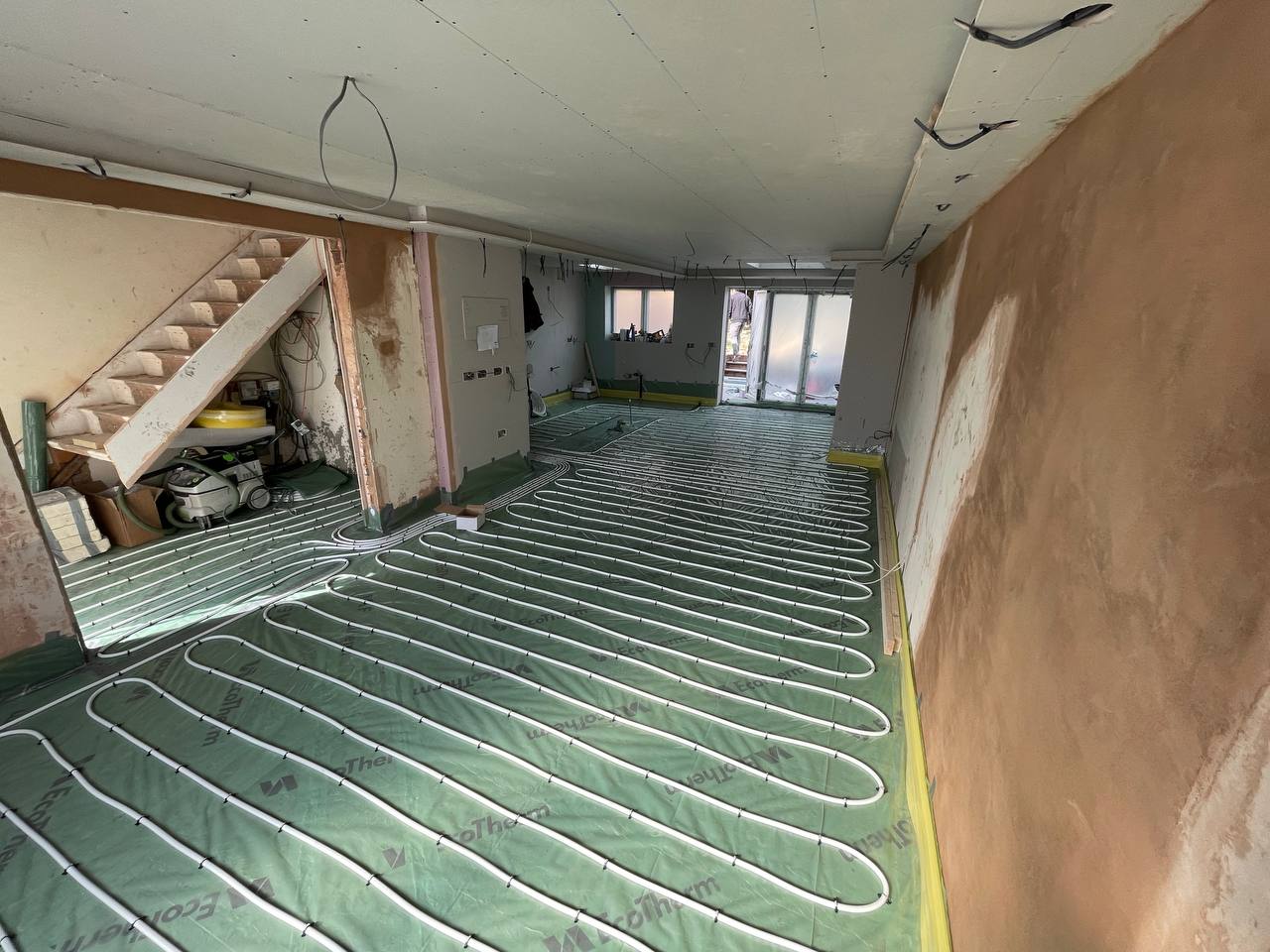 Wet underfloor heating installation in a North London extension
