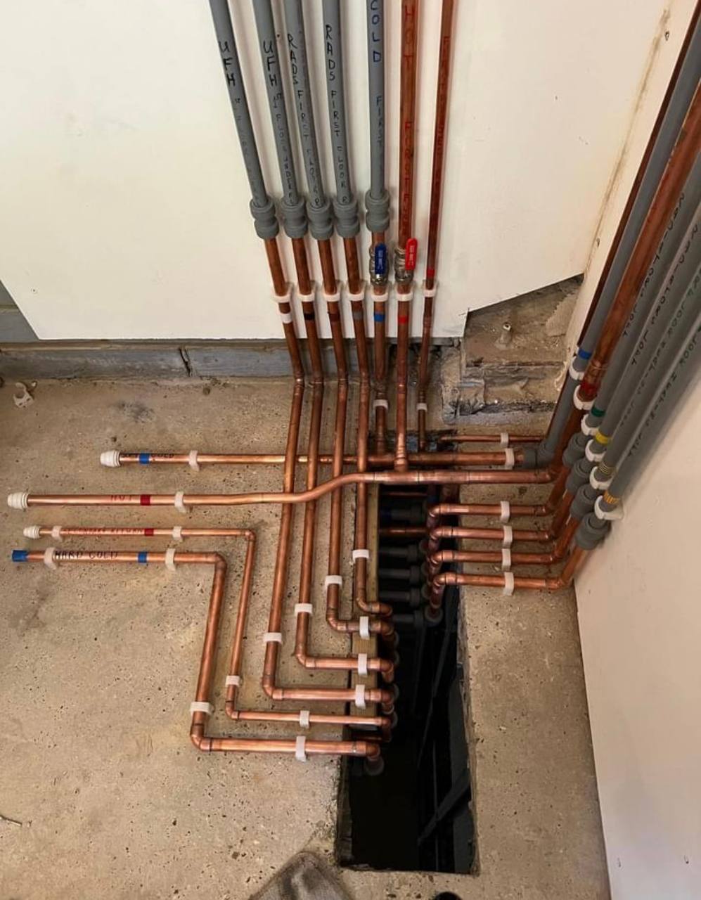 Central heating installation with pipework and cylinder in North London