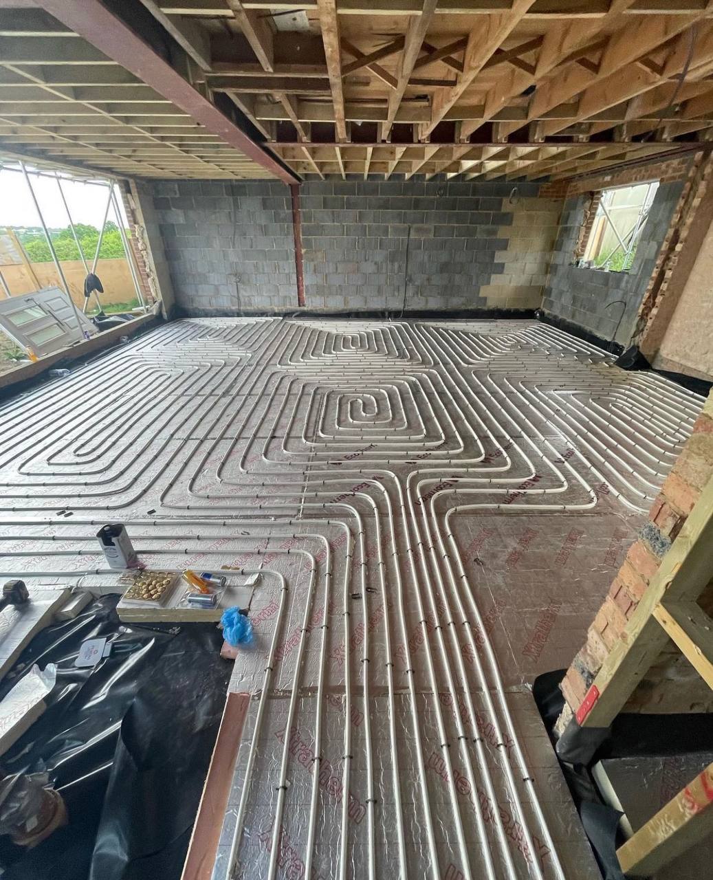 Wet underfloor heating installation in a North London extension