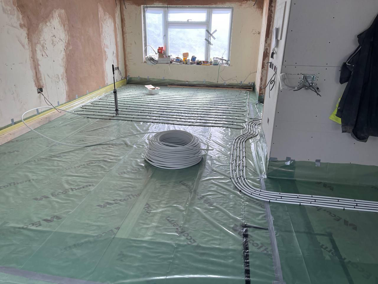 Wet underfloor heating installation in a North London extension