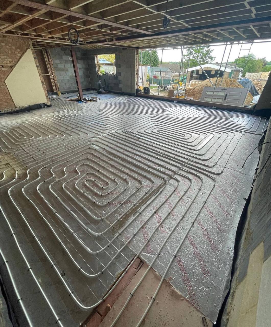 Wet underfloor heating installation in a North London extension