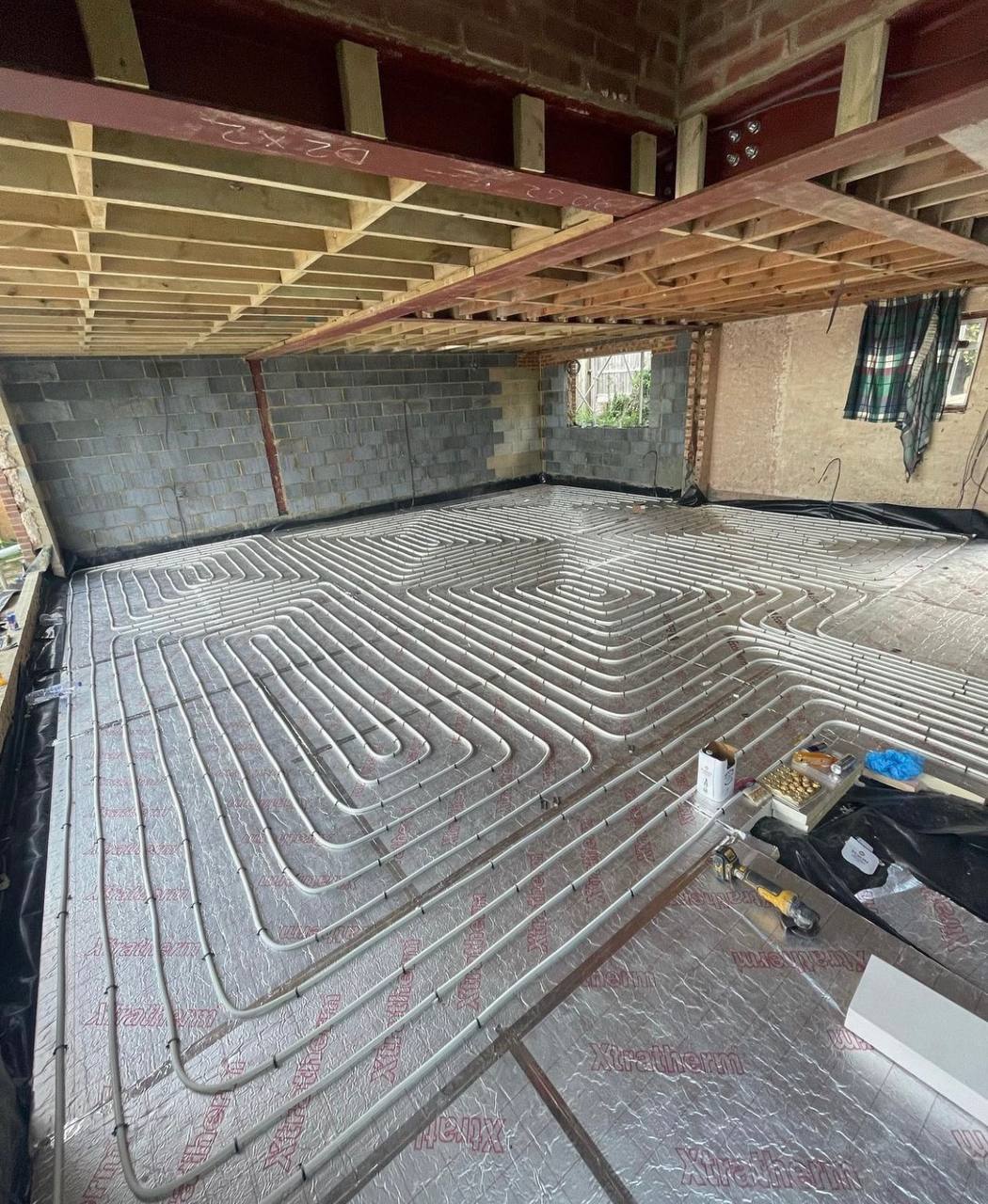 Wet underfloor heating installation in a North London extension