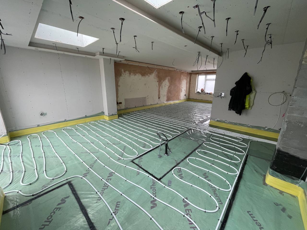 Wet underfloor heating installation in a North London extension