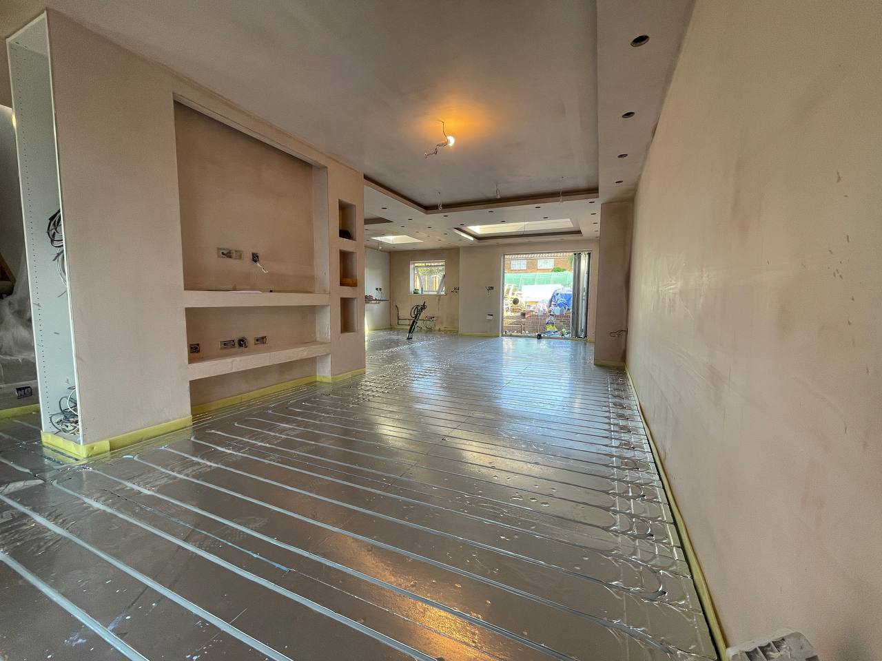Wet underfloor heating installation in a North London extension