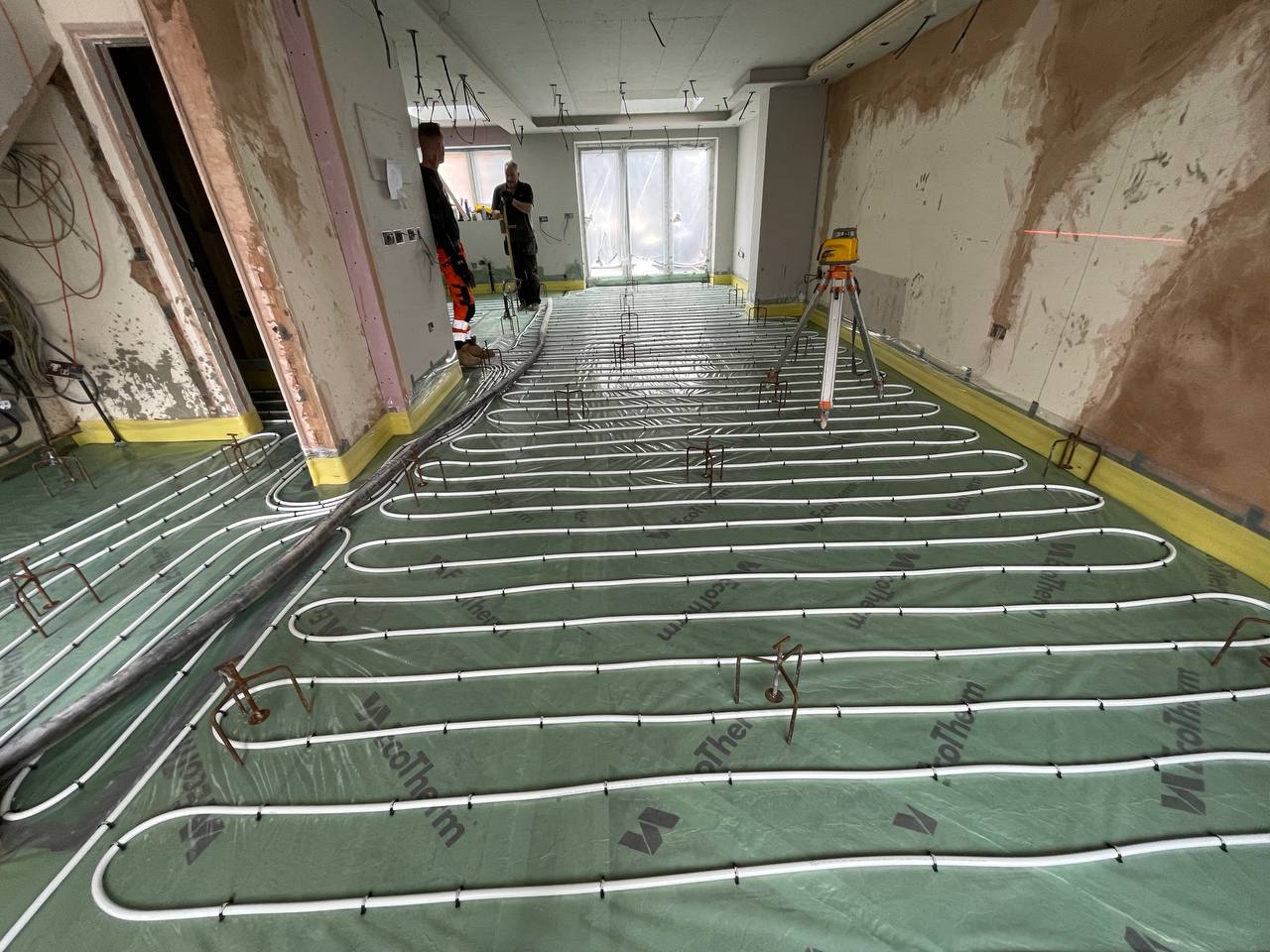 Wet underfloor heating installation in a North London extension