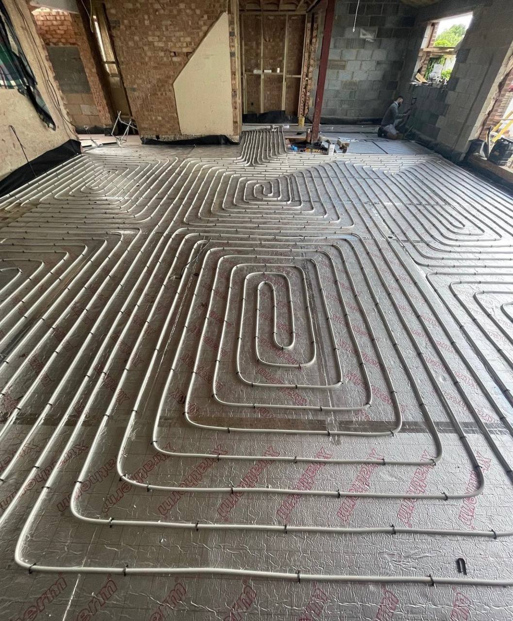 Wet underfloor heating installation in a North London extension