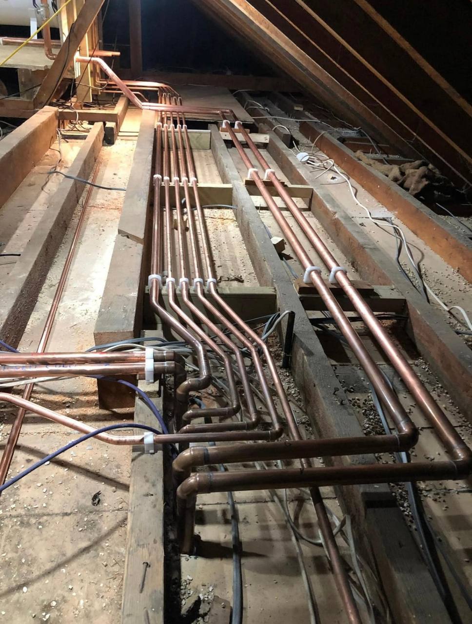 Central heating installation with pipework and cylinder in North London