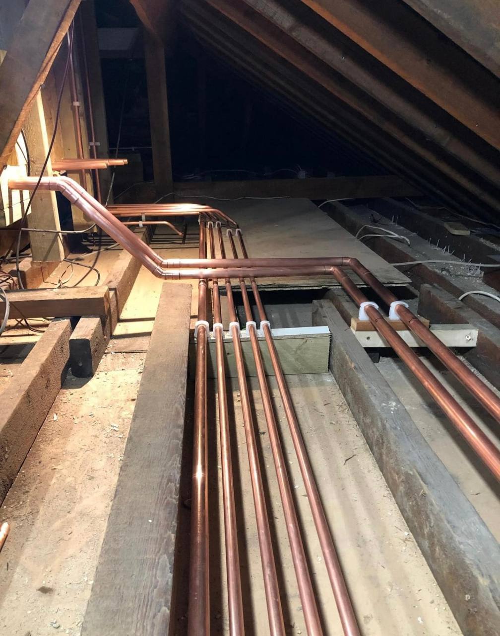 Central heating installation with pipework and cylinder in North London
