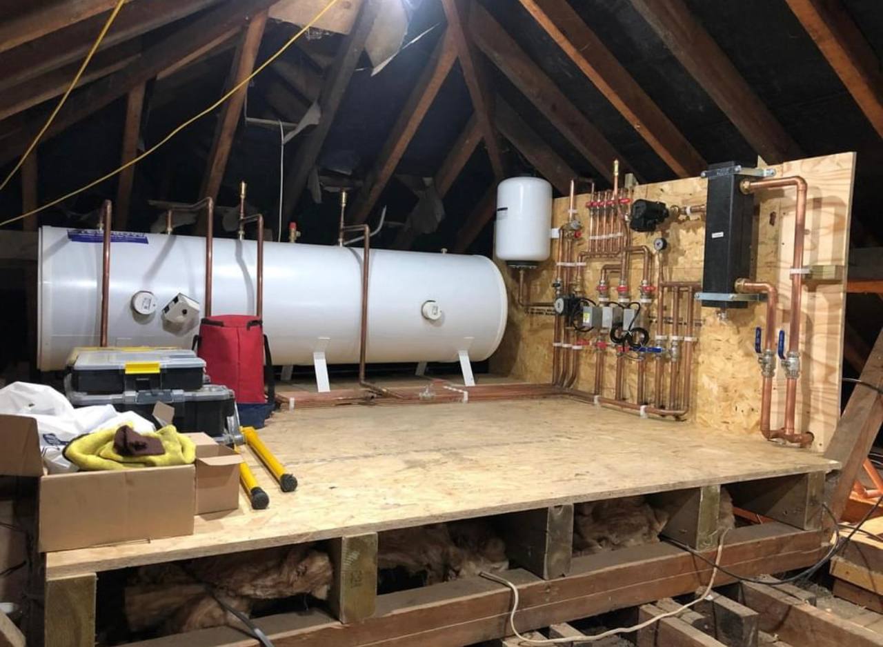 Central heating installation with pipework and cylinder in North London